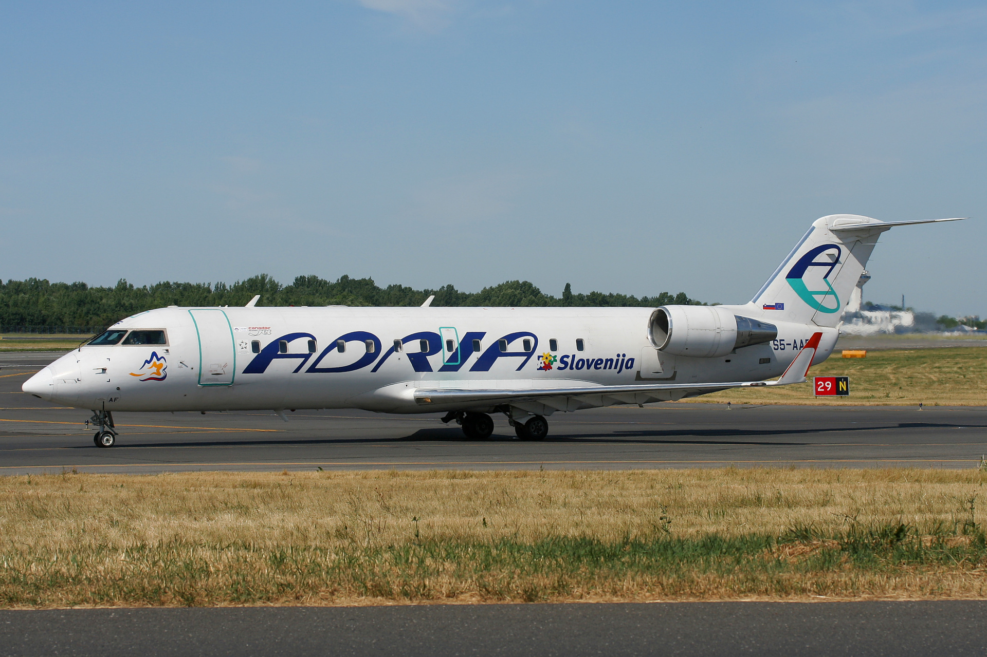 S5-AAF (Slovenia livery) (Aircraft » EPWA Spotting » Bombardier CL-600 Regional Jet » CRJ-200 » Adria Airways)