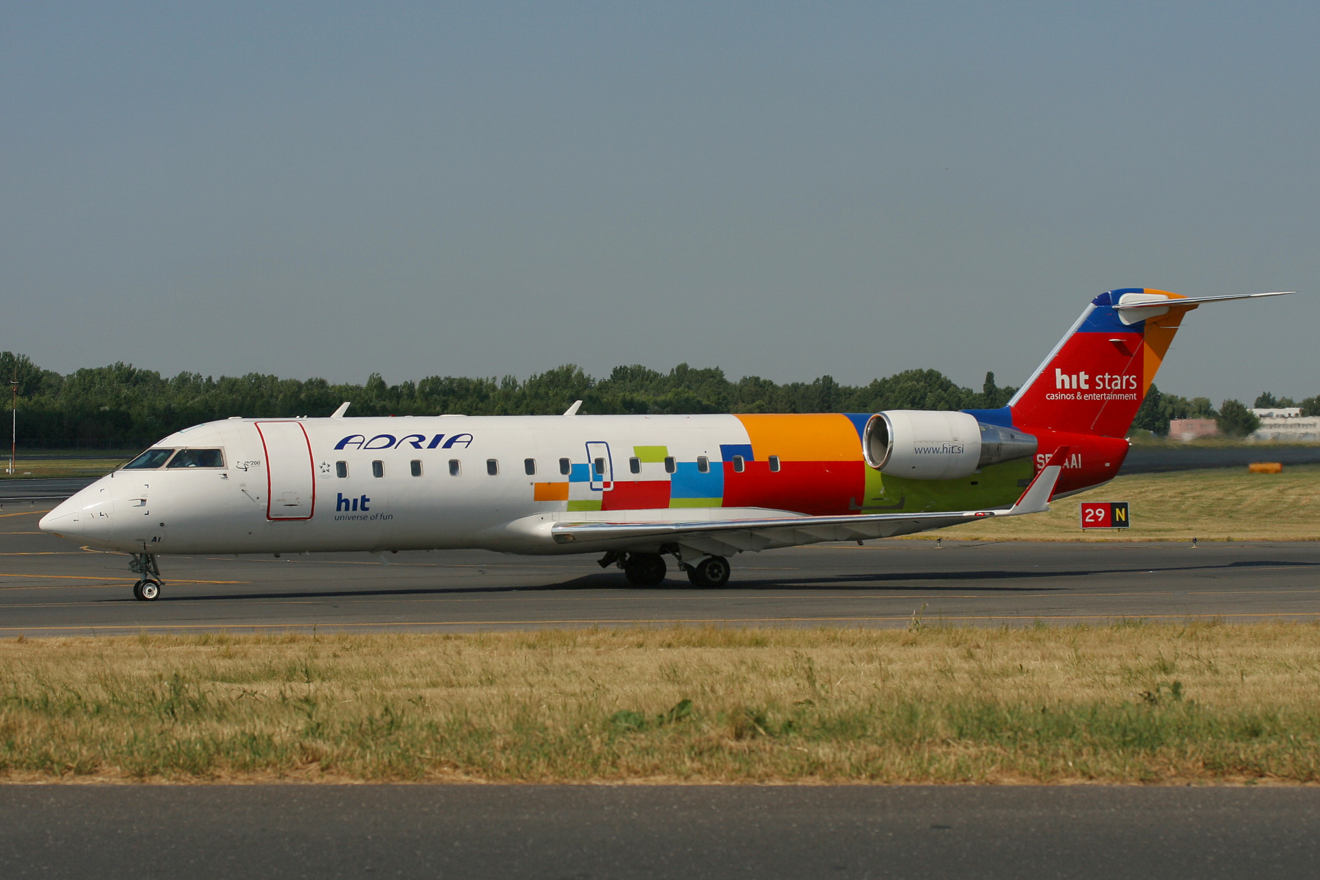 S5-AAI (Hit Stars livery) (Aircraft » EPWA Spotting » Bombardier CL-600 Regional Jet » CRJ-200 » Adria Airways)